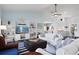 Open living room with high ceilings, hardwood floors, and white sofas at 538 25Th Se Ave, St Petersburg, FL 33705