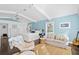 Bright main bedroom with king bed, sitting area and hardwood floors at 538 25Th Se Ave, St Petersburg, FL 33705