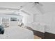 Main bedroom with a king-size bed, built-in cabinetry, and hardwood floors at 538 25Th Se Ave, St Petersburg, FL 33705