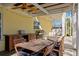 Covered patio with dining area, ceiling fan, and built-in grill at 538 25Th Se Ave, St Petersburg, FL 33705