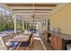 Covered patio with dining table and seating area at 538 25Th Se Ave, St Petersburg, FL 33705