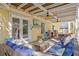 Covered patio with comfortable seating, hanging chairs and outdoor dining at 538 25Th Se Ave, St Petersburg, FL 33705