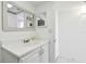 Bathroom featuring a large mirror and updated vanity at 5575 Gulf Blvd # 425, St Pete Beach, FL 33706