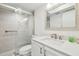 Bathroom featuring a glass shower, updated vanity, and modern finishes at 5575 Gulf Blvd # 425, St Pete Beach, FL 33706
