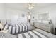 Bedroom with two beds, white furnishings, and access to hallway and bathroom at 5575 Gulf Blvd # 425, St Pete Beach, FL 33706