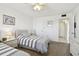 Bedroom with two beds, side table, and access to the hall and entryway at 5575 Gulf Blvd # 425, St Pete Beach, FL 33706