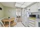 Cozy dining area is next to the kitchen area in the home at 5575 Gulf Blvd # 425, St Pete Beach, FL 33706