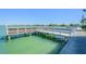 Picturesque dock with water views and bench seating at 5575 Gulf Blvd # 425, St Pete Beach, FL 33706