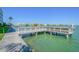 Waterfront property featuring a private dock for residents to dock boats, fish, and enjoy beautiful views at 5575 Gulf Blvd # 425, St Pete Beach, FL 33706