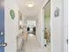 Inviting entryway boasts tile flooring, a stylish table, and a peek into the bright living area at 5575 Gulf Blvd # 425, St Pete Beach, FL 33706