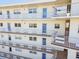 Exterior view of the condo with multiple floors, windows, and outdoor balconies at 5575 Gulf Blvd # 425, St Pete Beach, FL 33706