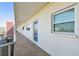 Exterior hallway view of this property on a sunny day at 5575 Gulf Blvd # 425, St Pete Beach, FL 33706