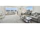 Open-concept living room with lots of natural light and comfortable seating at 5575 Gulf Blvd # 425, St Pete Beach, FL 33706