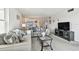 Bright living room with comfortable seating and stylish decor with neutral colors at 5575 Gulf Blvd # 425, St Pete Beach, FL 33706