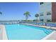 Enjoy the community's refreshing outdoor pool, lined with comfortable lounge chairs for relaxation at 5575 Gulf Blvd # 425, St Pete Beach, FL 33706