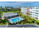 Community pool offering lush landscaping and space for relaxation and recreation at 5575 Gulf Blvd # 425, St Pete Beach, FL 33706