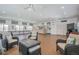 Spacious recreation room featuring comfortable seating and access to a kitchenette for community use at 5575 Gulf Blvd # 425, St Pete Beach, FL 33706