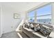 Sunroom showcases natural light, neutral sofa and exterior view at 5575 Gulf Blvd # 425, St Pete Beach, FL 33706