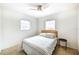 Bright bedroom with a comfortable bed and two windows at 6105 Antrim St, New Port Richey, FL 34653