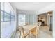 Simple dining area with a light wood table and four chairs at 6105 Antrim St, New Port Richey, FL 34653