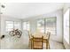 Bright dining area with large windows and a wooden table at 6105 Antrim St, New Port Richey, FL 34653