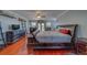 Main bedroom with hardwood floors and large sleigh bed at 783 Placido Ne Way, St Petersburg, FL 33704