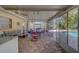Spacious screened patio with pavers, seating area, and pool view at 783 Placido Ne Way, St Petersburg, FL 33704