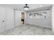Bright bedroom with sliding barn door and marble tile floor at 900 31St Ne Ave, St Petersburg, FL 33704