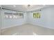 Spacious bedroom with light blue walls and large windows at 900 31St Ne Ave, St Petersburg, FL 33704