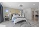 Serene bedroom with plush bedding, grey accents, and an ensuite bathroom at 900 31St Ne Ave, St Petersburg, FL 33704