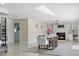 Bright dining room with a fireplace and access to the pool area at 900 31St Ne Ave, St Petersburg, FL 33704