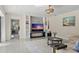 Gathering room with a large TV and comfortable seating at 900 31St Ne Ave, St Petersburg, FL 33704