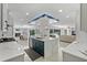 Renovated kitchen featuring a large island, marble countertops, and stainless steel appliances at 900 31St Ne Ave, St Petersburg, FL 33704