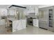 Gourmet kitchen with marble countertops, stainless steel appliances, and custom cabinetry at 900 31St Ne Ave, St Petersburg, FL 33704