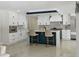 Modern kitchen with white cabinets, marble countertops, and an island at 900 31St Ne Ave, St Petersburg, FL 33704