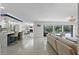 Open floor plan living room with a view of the pool and kitchen at 900 31St Ne Ave, St Petersburg, FL 33704