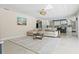 Living area features a sectional sofa and open concept to kitchen at 900 31St Ne Ave, St Petersburg, FL 33704