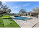 Backyard oasis featuring a pool, putting green, and patio at 900 31St Ne Ave, St Petersburg, FL 33704