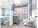 Clean bathroom with shower/tub combo and gray vanity at 9465 50Th N Way, Pinellas Park, FL 33782