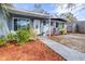 Attractive front yard with walkway, landscaping, and a charming entrance at 9465 50Th N Way, Pinellas Park, FL 33782