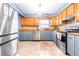 Modern kitchen featuring stainless steel appliances and wood cabinets at 9465 50Th N Way, Pinellas Park, FL 33782