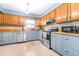 Updated kitchen with butcher block countertops, stainless steel appliances, and light blue cabinets at 9465 50Th N Way, Pinellas Park, FL 33782