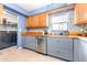 Kitchen with butcher block countertops, stainless steel appliances, and laundry access at 9465 50Th N Way, Pinellas Park, FL 33782