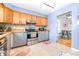 Updated kitchen with stainless steel appliances and wood cabinets at 9465 50Th N Way, Pinellas Park, FL 33782