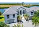 Luxury waterfront home with tile roof and three car garage at 1024 Sonata Ln, Apollo Beach, FL 33572
