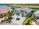 Luxury waterfront home with a circular driveway at 1024 Sonata Ln, Apollo Beach, FL 33572