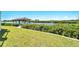 Covered patio overlooking a canal with lush landscaping at 1024 Sonata Ln, Apollo Beach, FL 33572
