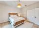 Charming bedroom with a queen bed, shiplap accent wall, and ample closet space at 1024 Sonata Ln, Apollo Beach, FL 33572