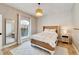 Bright bedroom with a comfortable bed, neutral decor, and a ceiling light at 1024 Sonata Ln, Apollo Beach, FL 33572
