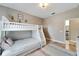 Well-lit bedroom featuring a bunk bed and built-in drawers at 1024 Sonata Ln, Apollo Beach, FL 33572